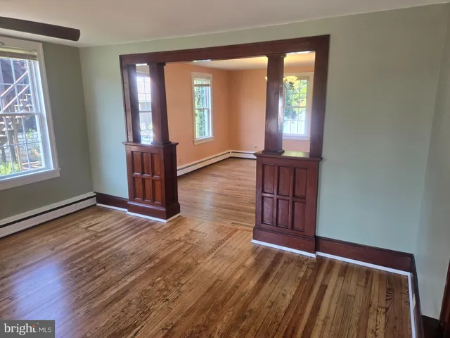 a view of a room with wooden floor and stairs
