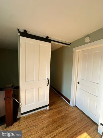 a bathroom with a granite countertop bathtub sink vanity and toilet