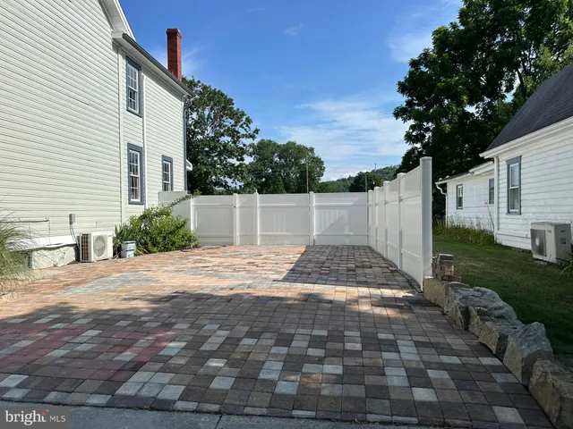a view of a backyard of the house