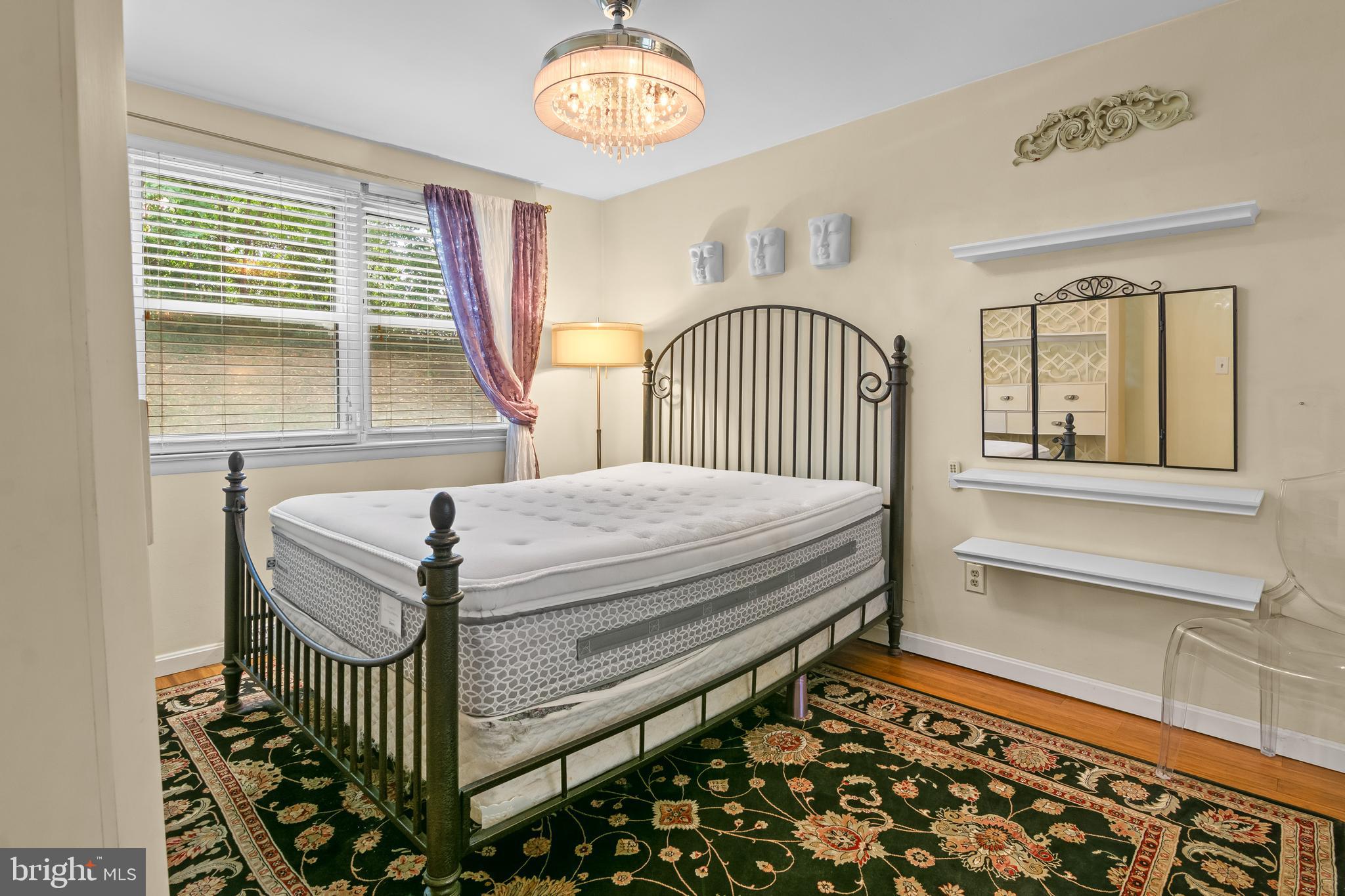 4415 Falls Bridge Drive, Unit K Baltimore, MD 21211 - Photo 15 of 18 a bedroom with a bed and a window