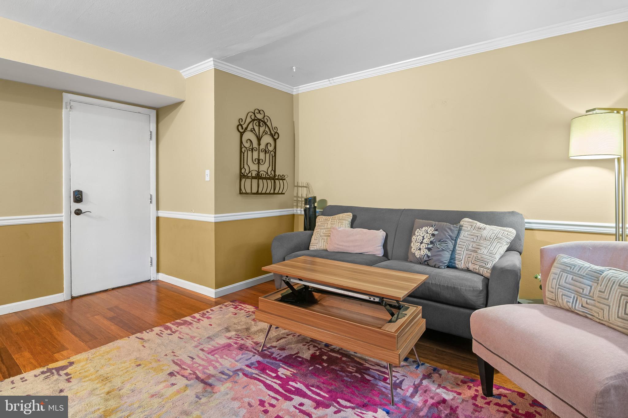 4415 Falls Bridge Drive, Unit K Baltimore, MD 21211 - Photo 6 of 18 a bedroom with a bed and wooden floor