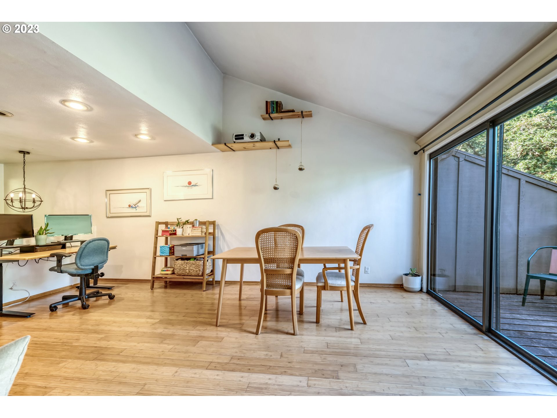 422 Stonewood Drive Eugene, OR 97405 - Photo 11 of 32 a view of a dining room with furniture and wooden floor