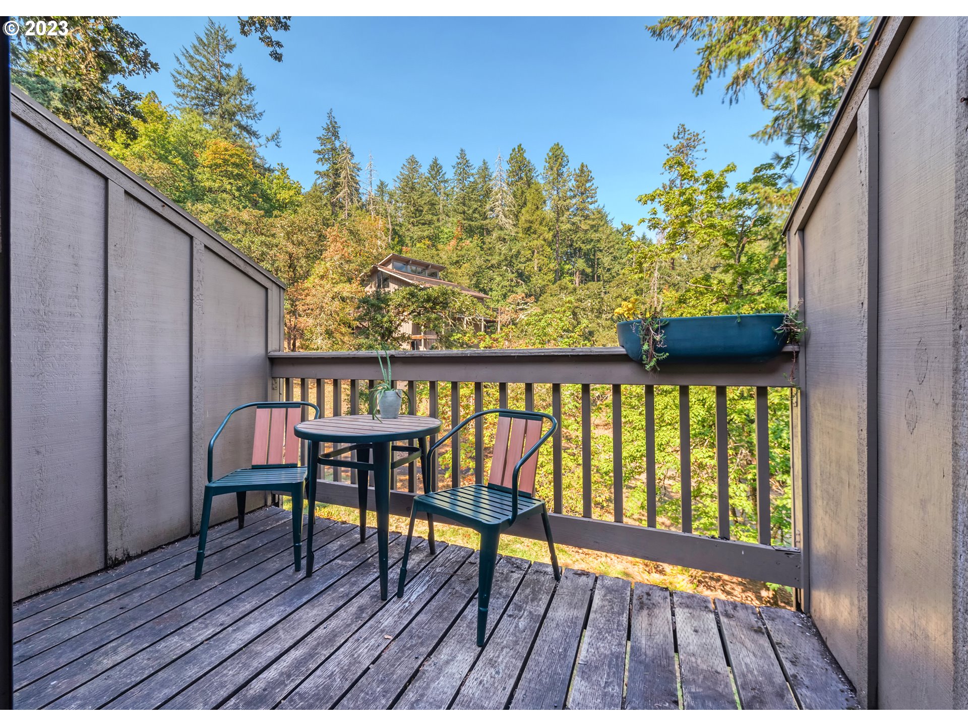 422 Stonewood Drive Eugene, OR 97405 - Photo 16 of 32 a view of a chairs on the deck
