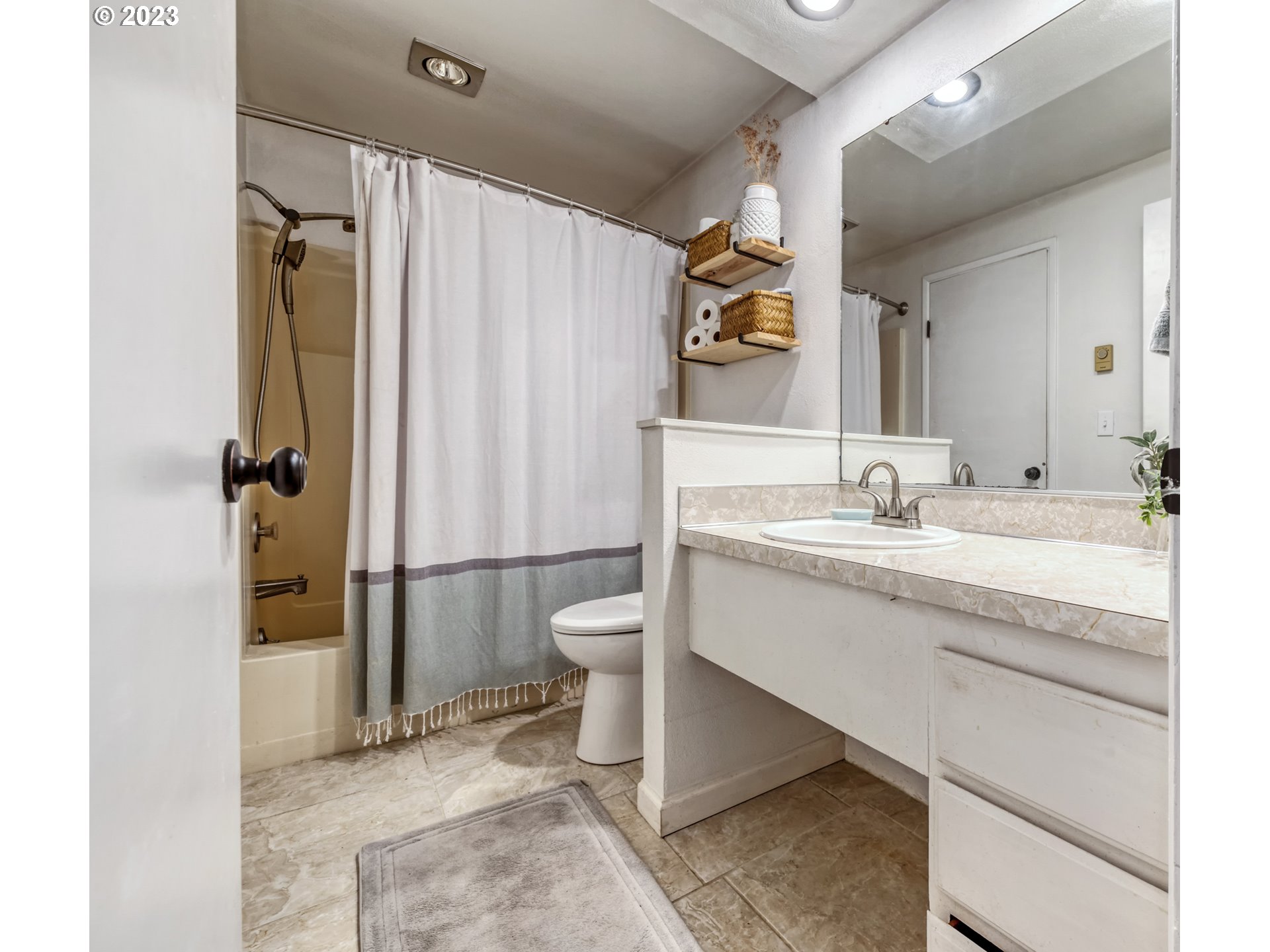 422 Stonewood Drive Eugene, OR 97405 - Photo 21 of 32 a bathroom with a double vanity sink toilet and shower
