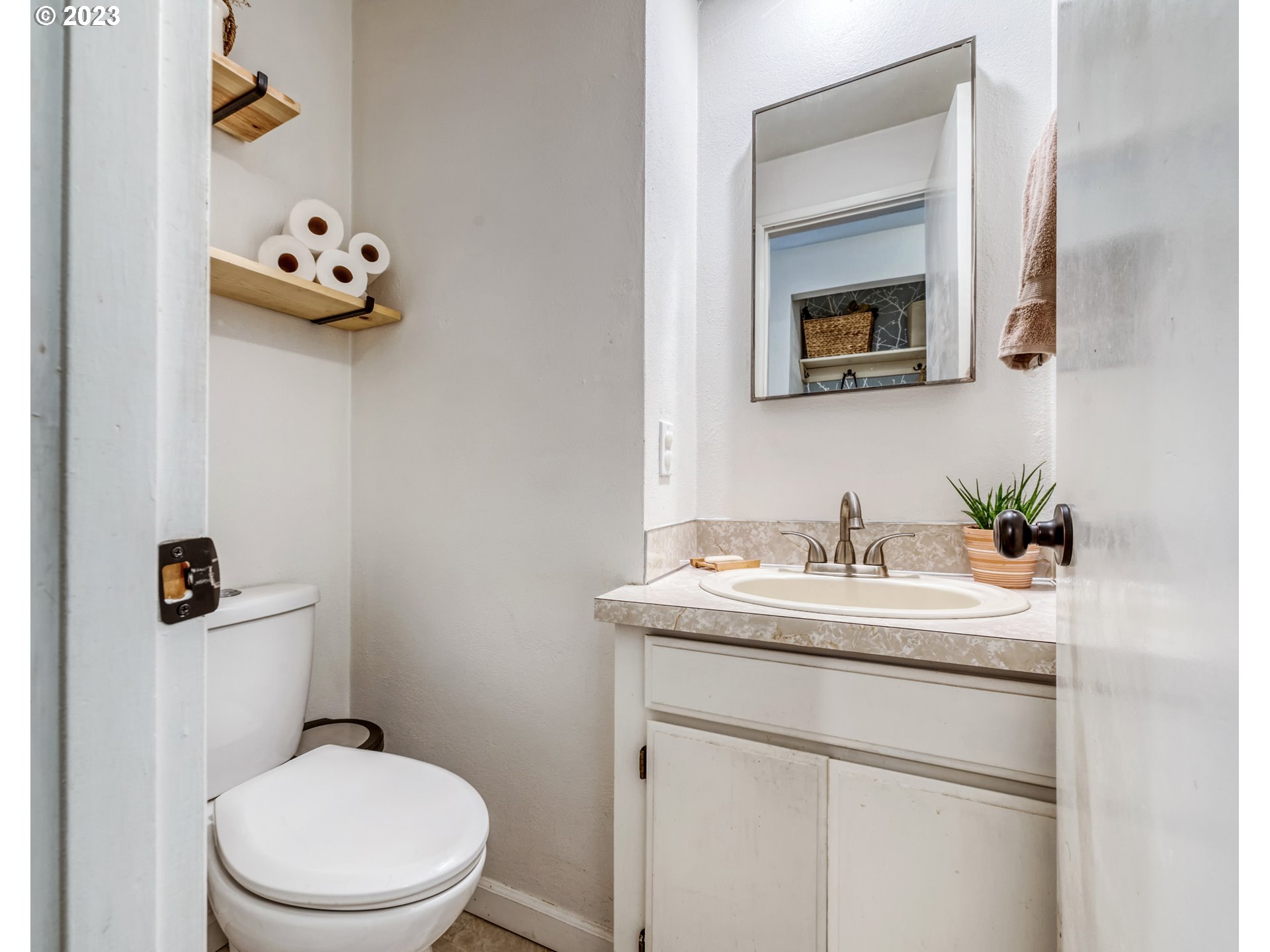 422 Stonewood Drive Eugene, OR 97405 - Photo 22 of 32 a bathroom with a sink vanity mirror and toilet
