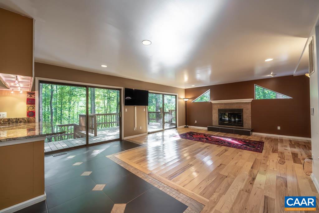 12 Rowell Road Palmyra, VA 22963 - Photo 29 of 75 a view of a room with gym equipment and a fireplace