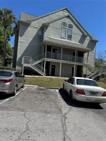 a front view of a house with parking space