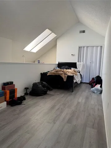 a bed room with furniture and a window