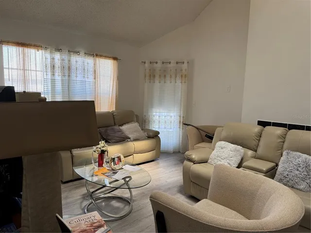 a living room with furniture and a window