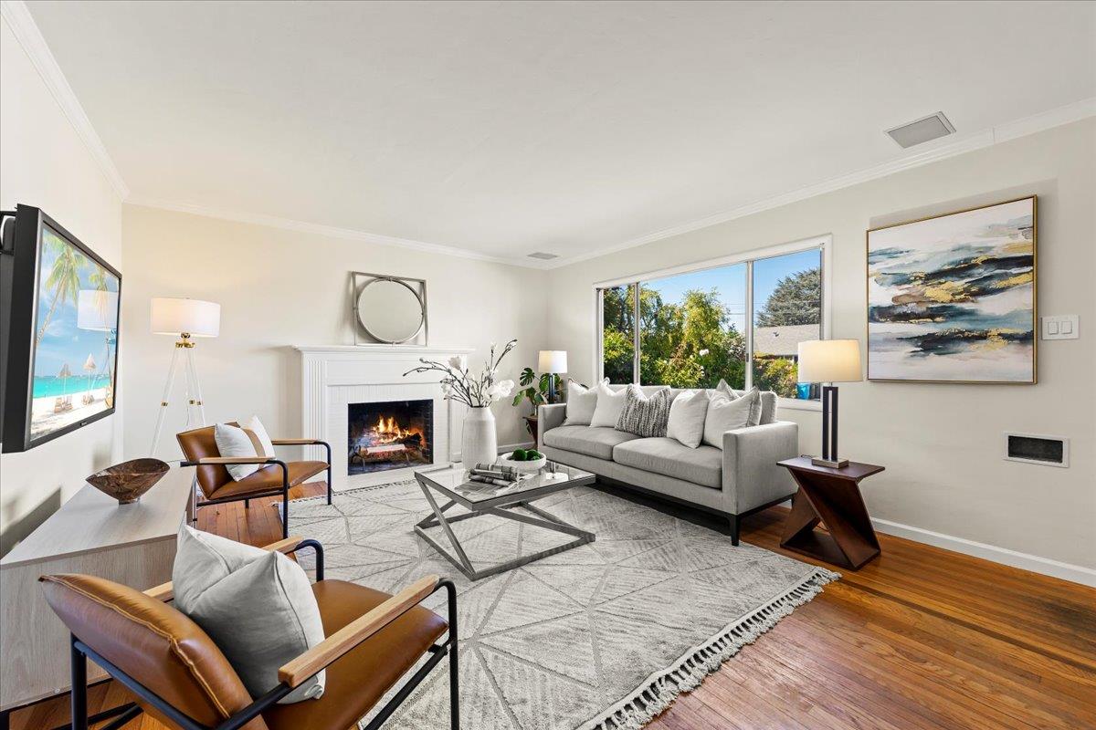 1100 Irwin Street Belmont, CA 94002 - Photo 2 of 53 a living room with furniture a fireplace and a flat screen tv
