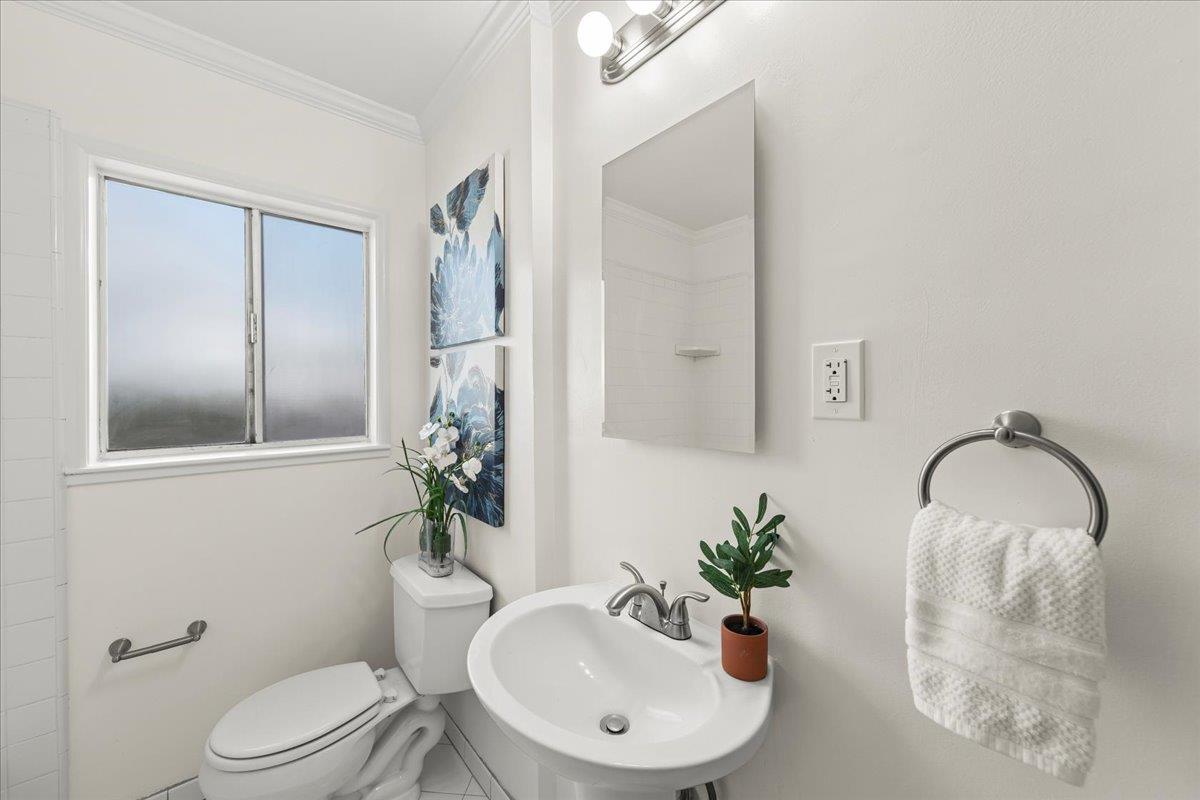 1100 Irwin Street Belmont, CA 94002 - Photo 21 of 53 a bathroom with a sink toilet and a mirror