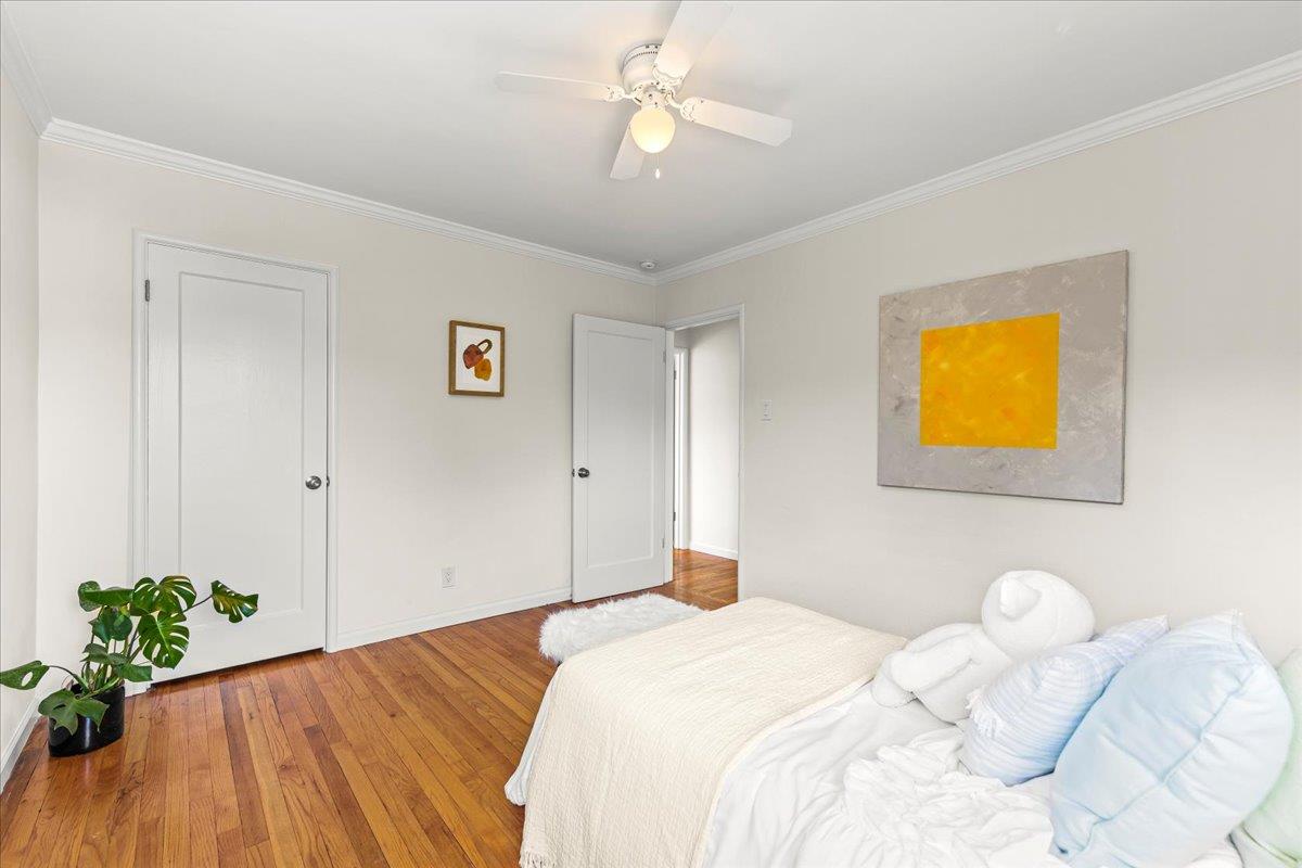 1100 Irwin Street Belmont, CA 94002 - Photo 27 of 53 a bedroom with a bed and a chandelier