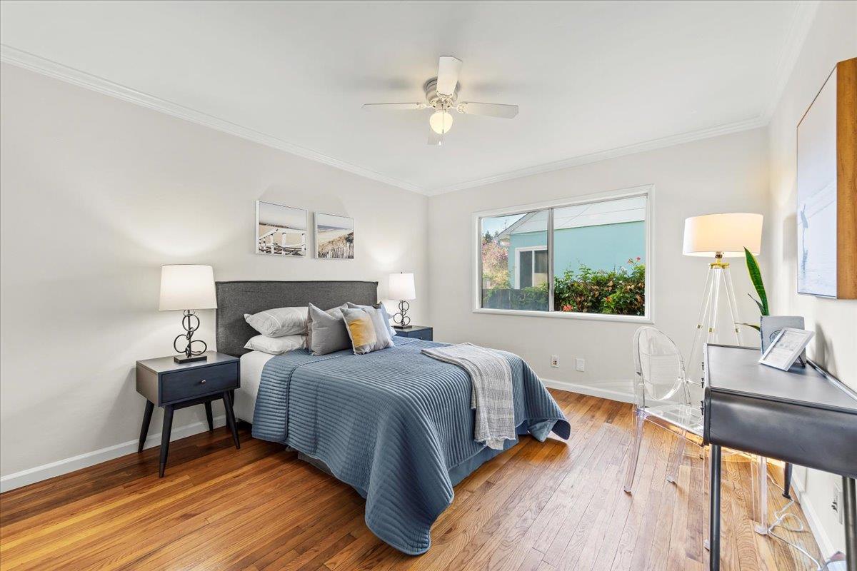 1100 Irwin Street Belmont, CA 94002 - Photo 28 of 53 a bedroom with a bed and a large window with wooden floor