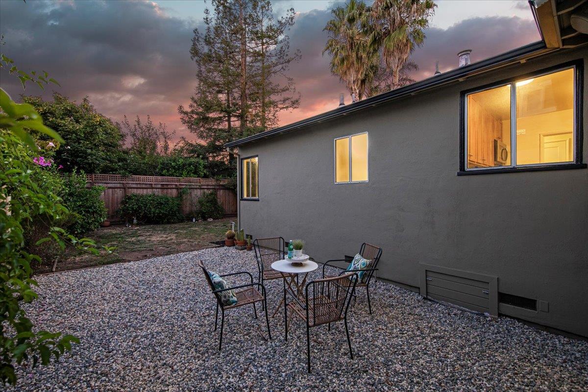 1100 Irwin Street Belmont, CA 94002 - Photo 30 of 53 a view of a backyard with furniture and a garden