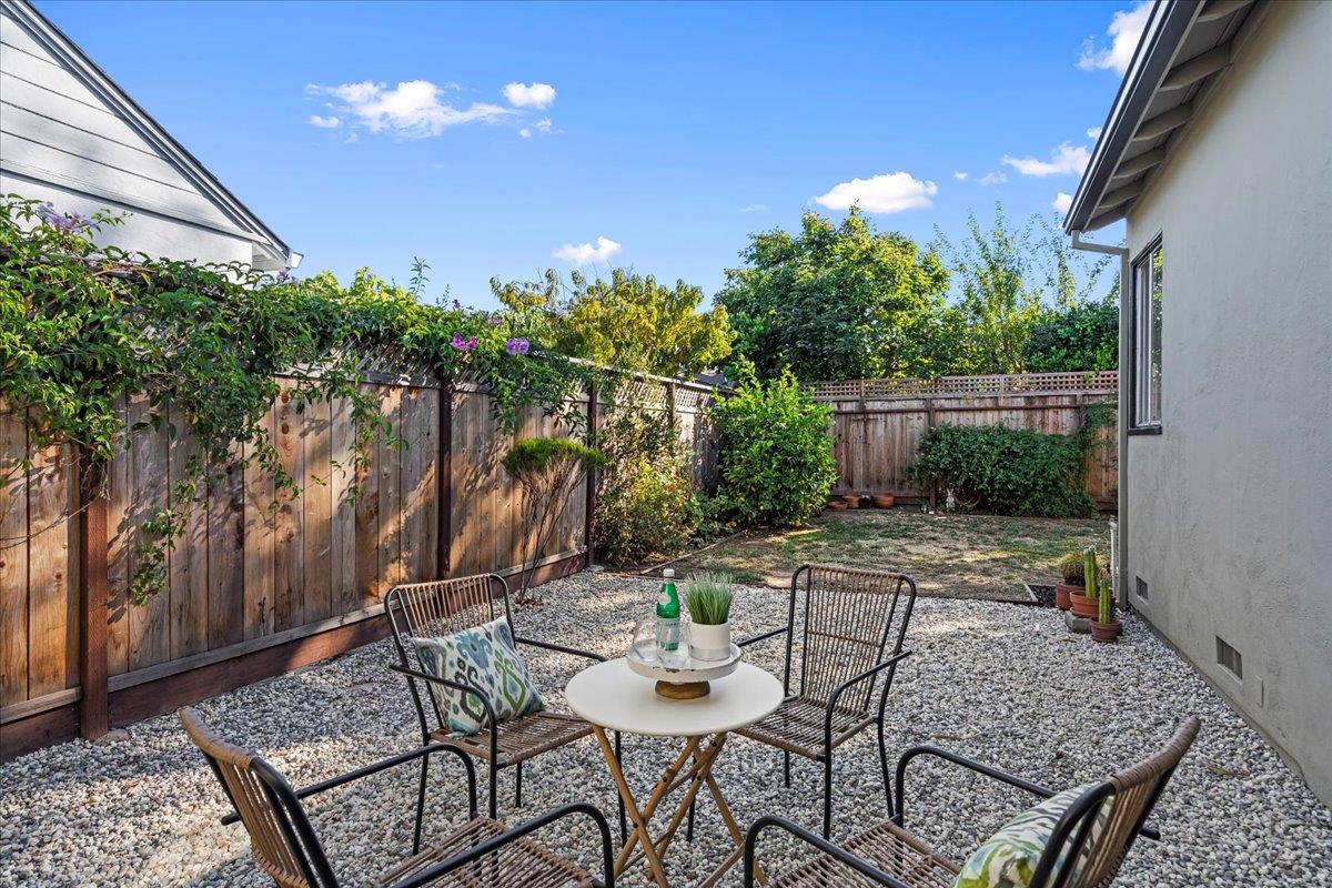 1100 Irwin Street Belmont, CA 94002 - Photo 31 of 53 a view of a backyard with plants and outdoor seating