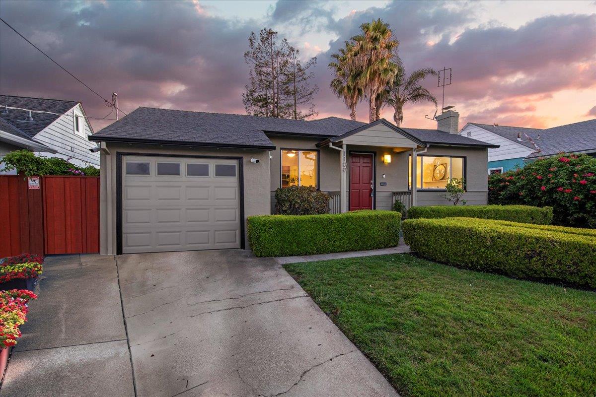 1100 Irwin Street Belmont, CA 94002 - Photo 5 of 53 a front view of a house with a yard and garage