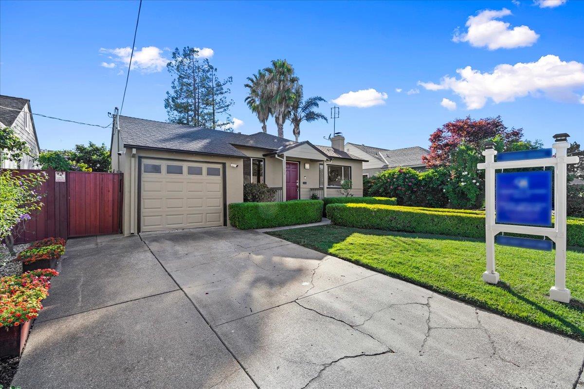 1100 Irwin Street Belmont, CA 94002 - Photo 7 of 53 a view of a house with a yard and a garden