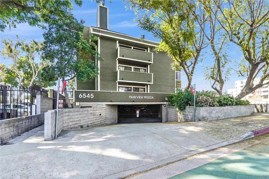 6545 Reseda Boulevard, Unit 6 Reseda, CA 91335 - Photo 1 of 32 a front view of a house with a yard