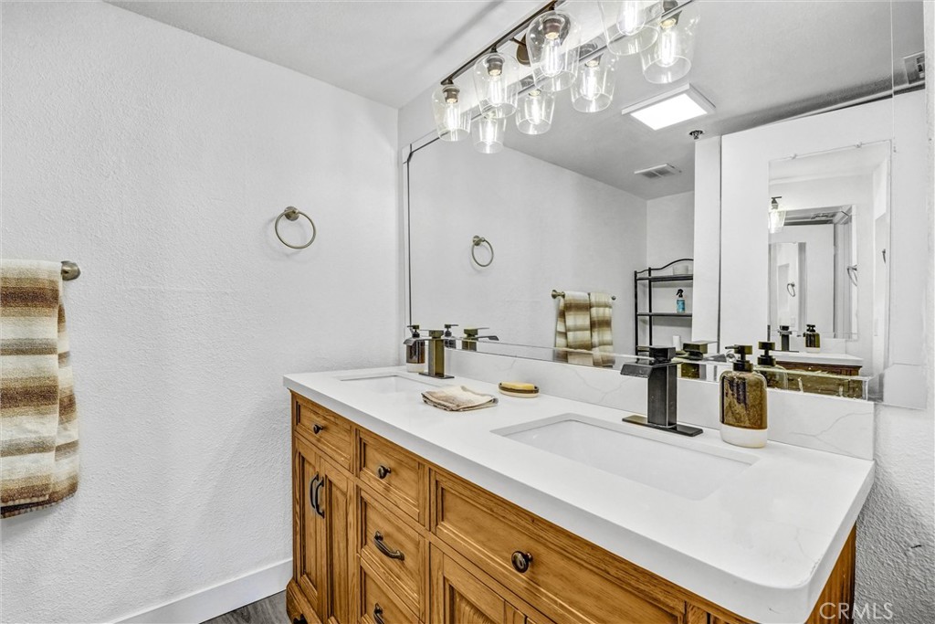 6545 Reseda Boulevard, Unit 6 Reseda, CA 91335 - Photo 19 of 32 a bathroom with a sink double vanity and a mirror