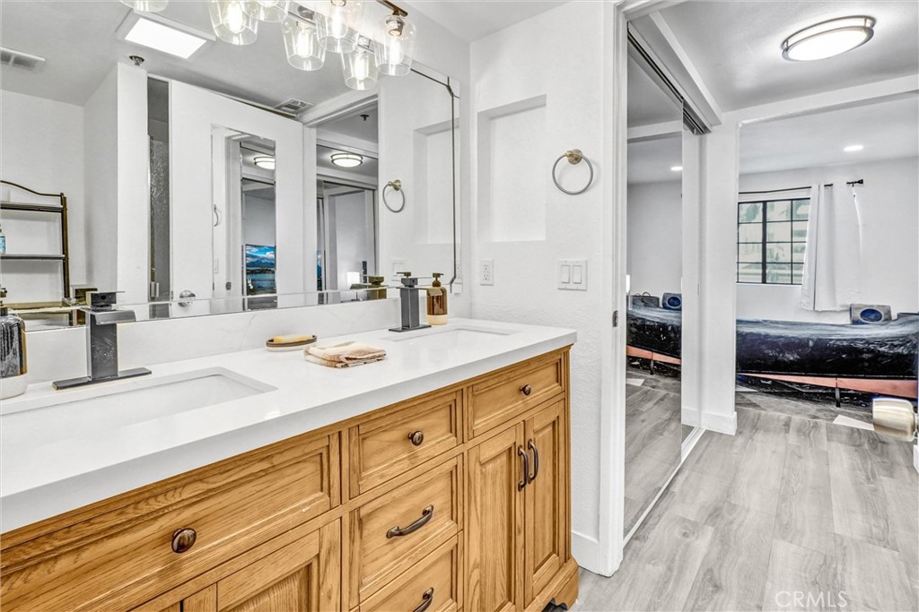 6545 Reseda Boulevard, Unit 6 Reseda, CA 91335 - Photo 20 of 32 a spacious bathroom with a sink double vanity granite and a large mirror