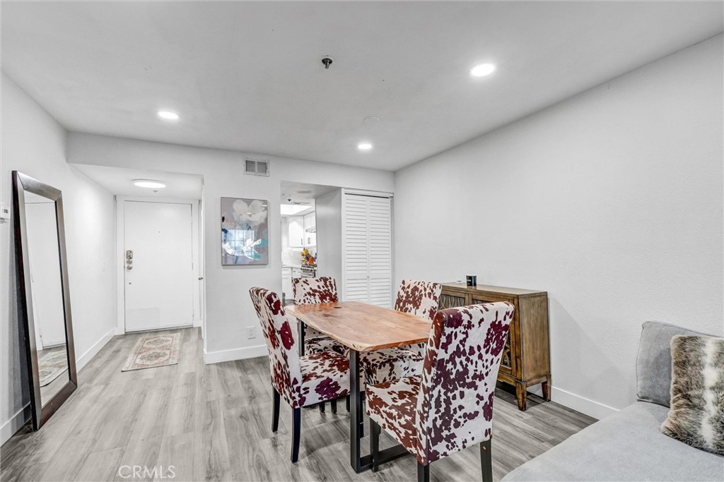 6545 Reseda Boulevard, Unit 6 Reseda, CA 91335 - Photo 6 of 32 a view of a dining room with furniture and wooden floor
