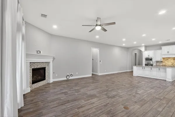 a view of an empty room with a fireplace