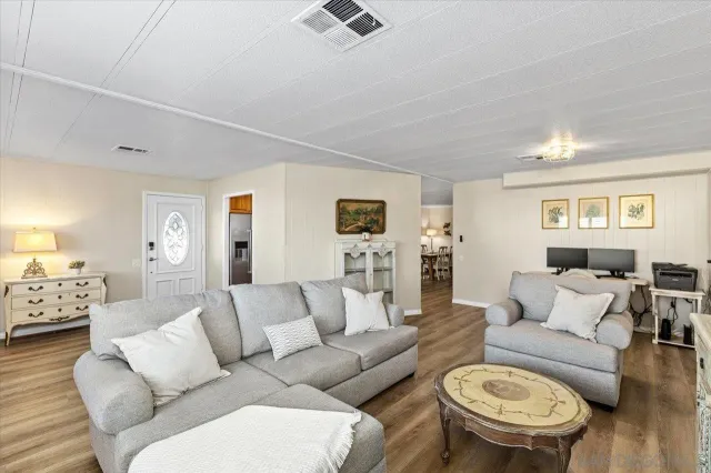 a living room with furniture and a table