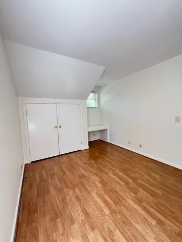 a view of balcony with wooden floor