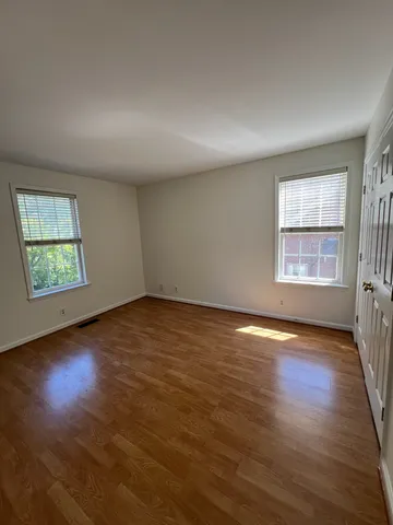 a view of backyard with a large tree