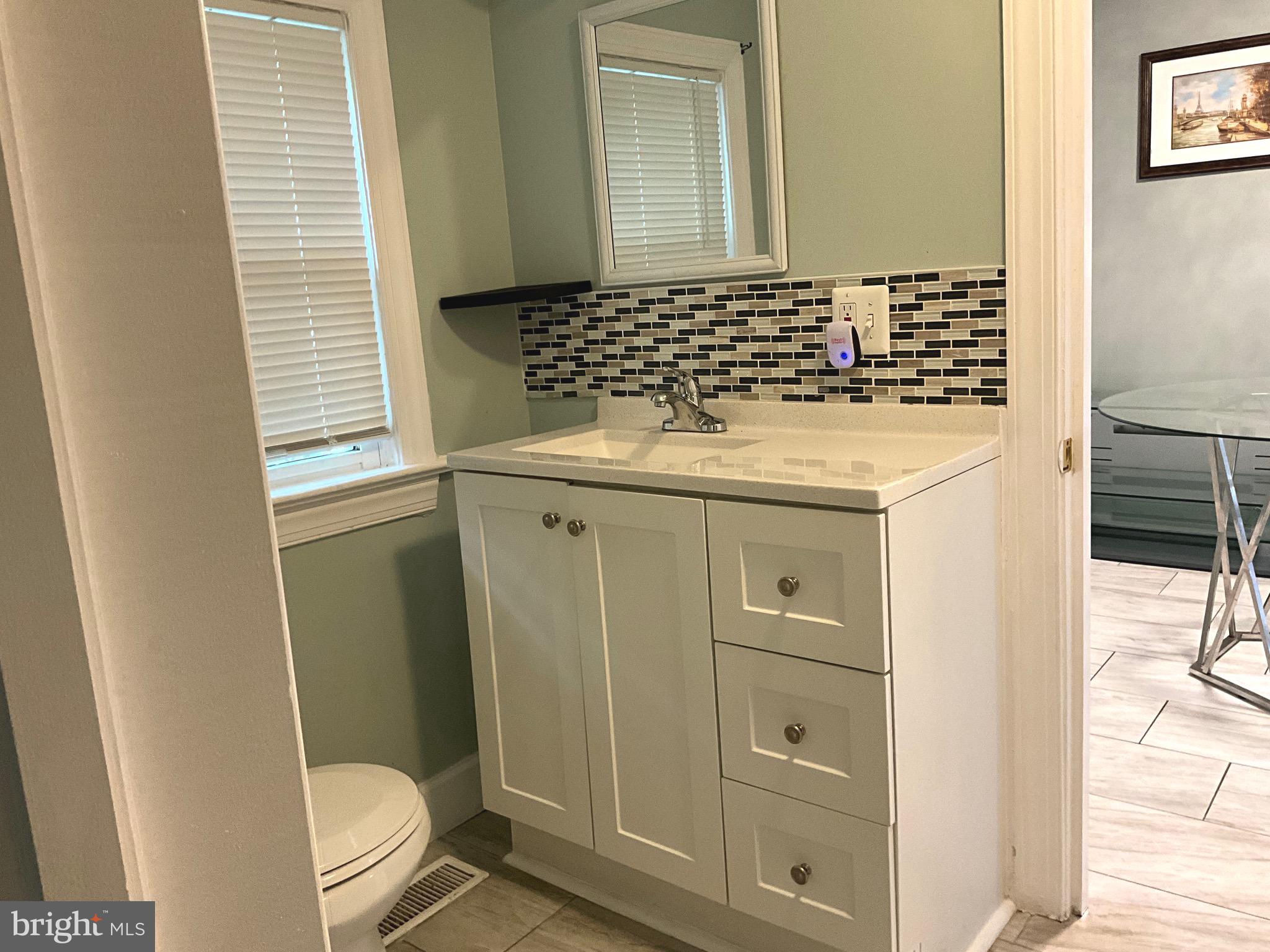 86 Kelley Road Fredericksburg, VA 22405 - Photo 25 of 36 a bathroom with a granite countertop sink toilet and shower