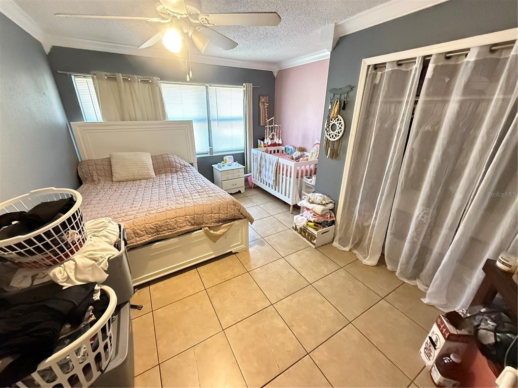 460 West Pierce Street Lake Alfred, FL 33850 - Photo 16 of 41 a bedroom with a bed and a window