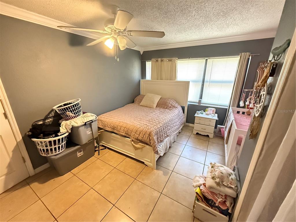 460 West Pierce Street Lake Alfred, FL 33850 - Photo 17 of 41 a bedroom with a bed and a mirror