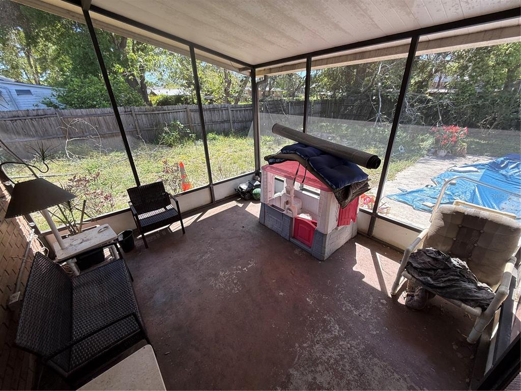 460 West Pierce Street Lake Alfred, FL 33850 - Photo 32 of 41 a bedroom with furniture and a large window