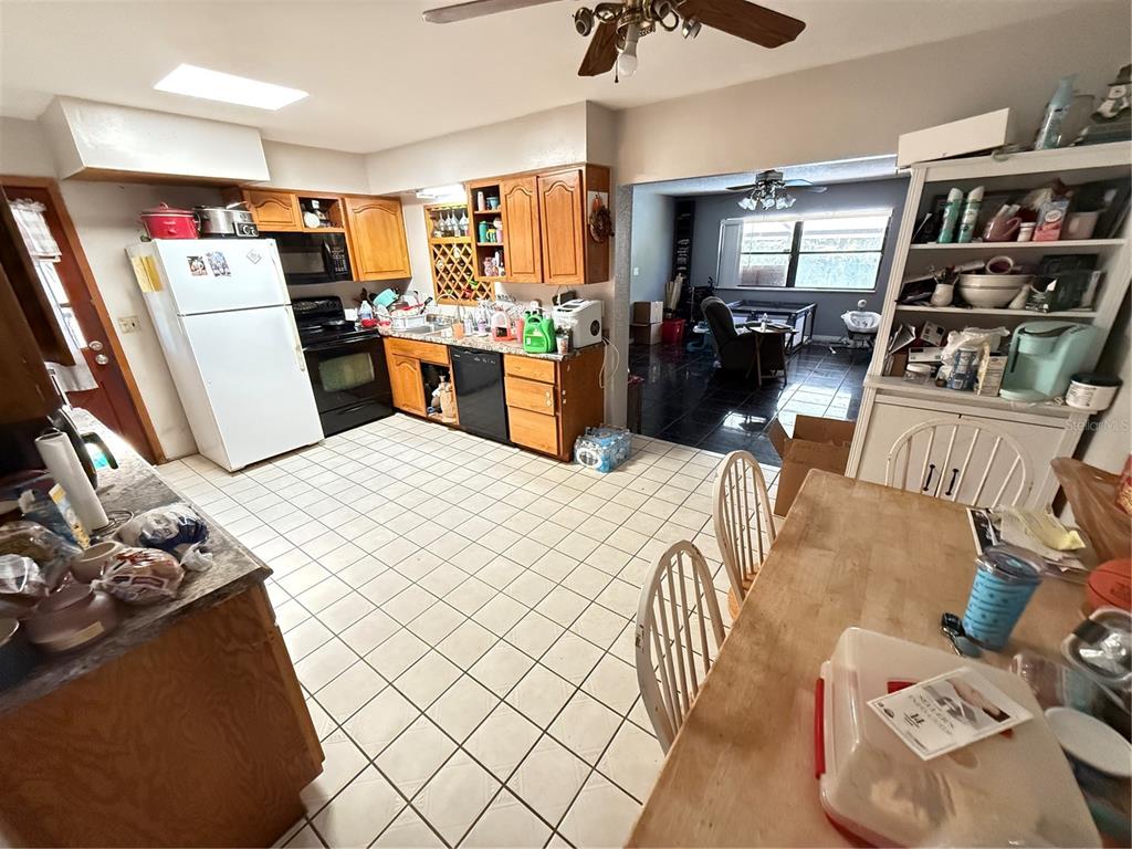 460 West Pierce Street Lake Alfred, FL 33850 - Photo 5 of 41 a bedroom with a bed and cabinets
