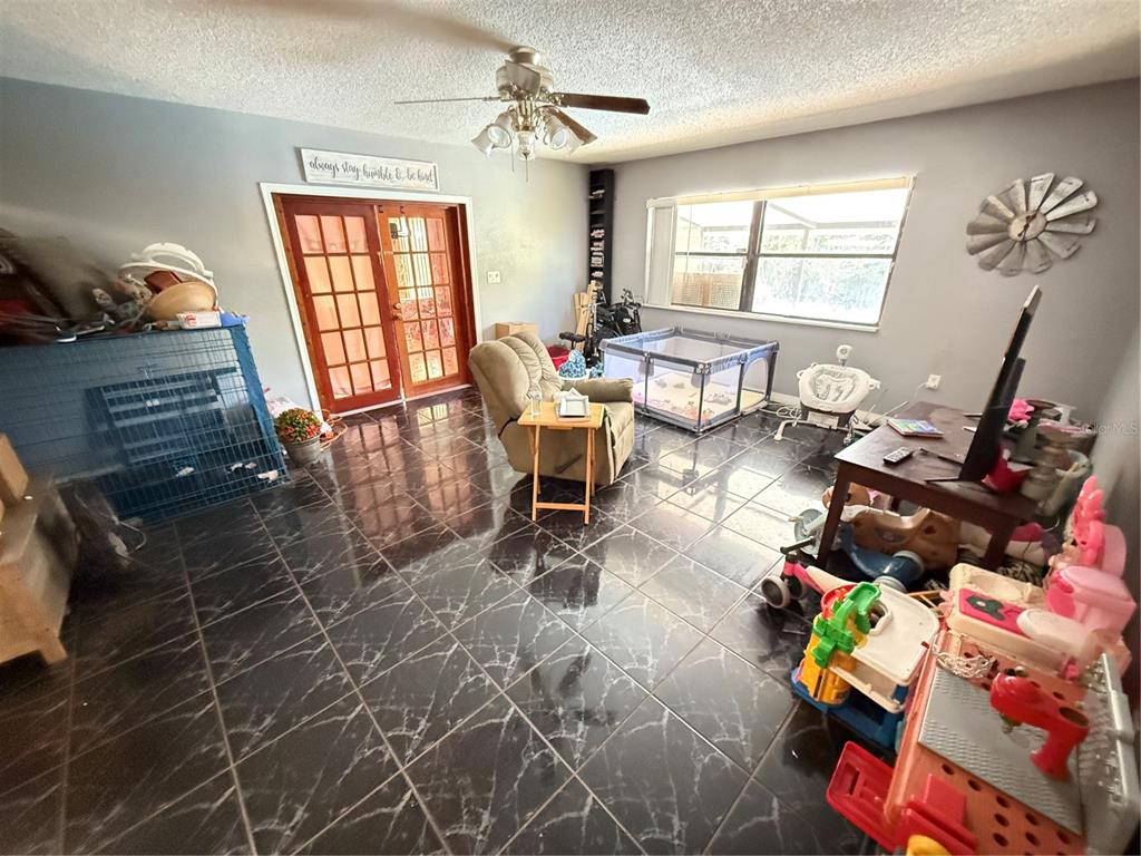 460 West Pierce Street Lake Alfred, FL 33850 - Photo 9 of 41 a living room filled with furniture and a window