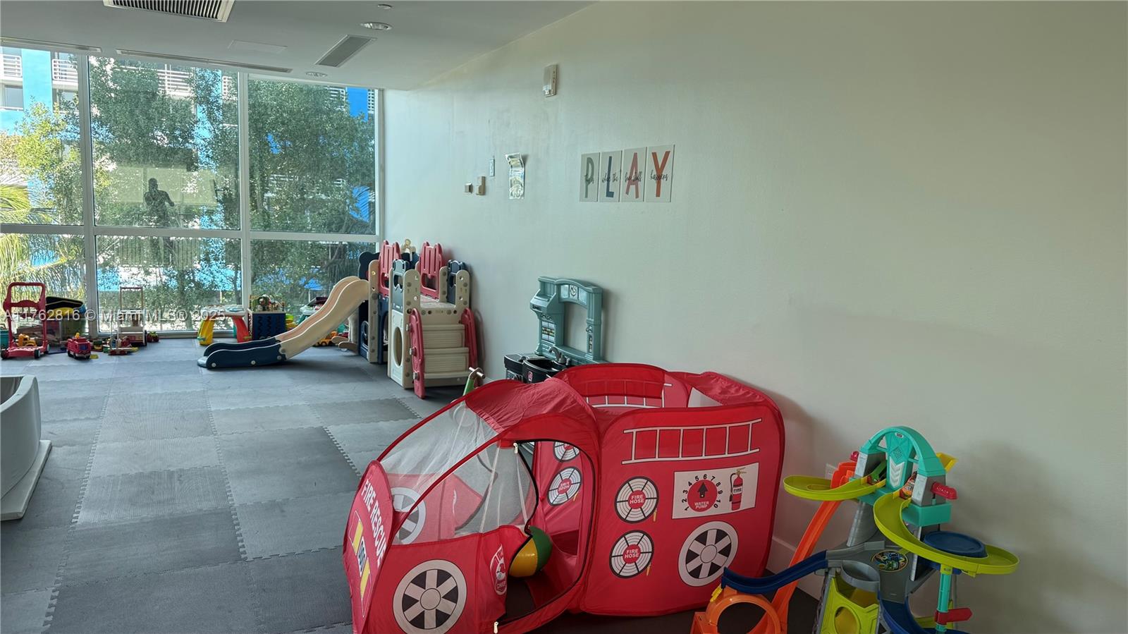 2101 Brickell Avenue, Unit 1012 Miami, FL 33129 - Photo 22 of 40 a bedroom with a bed and a window