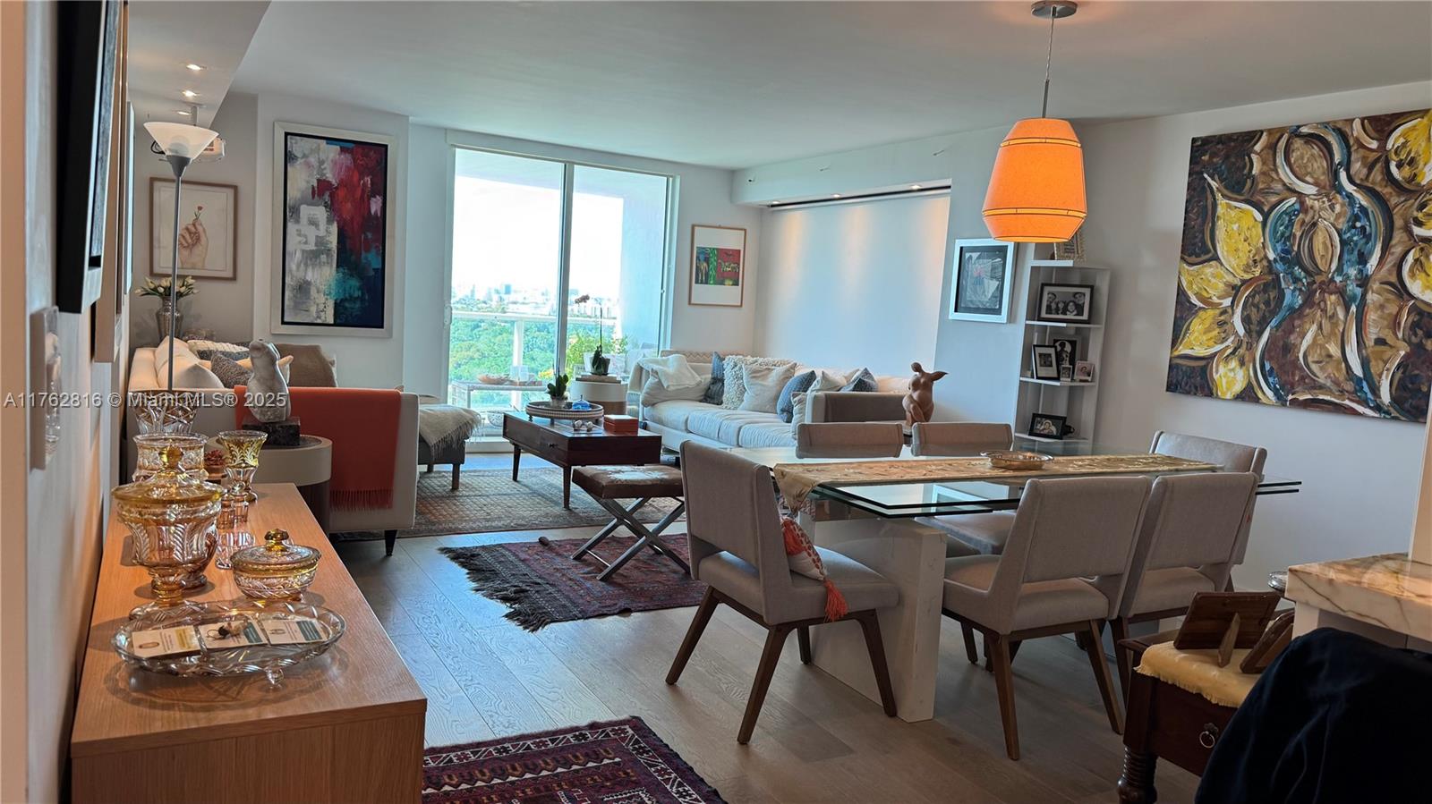 2101 Brickell Avenue, Unit 1012 Miami, FL 33129 - Photo 27 of 40 a living room with fireplace furniture and a window