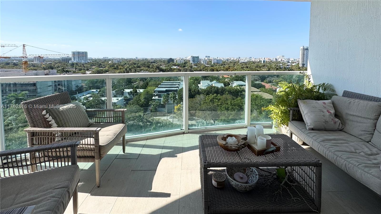 2101 Brickell Avenue, Unit 1012 Miami, FL 33129 - Photo 29 of 40 a view of a deck with couches table and chairs