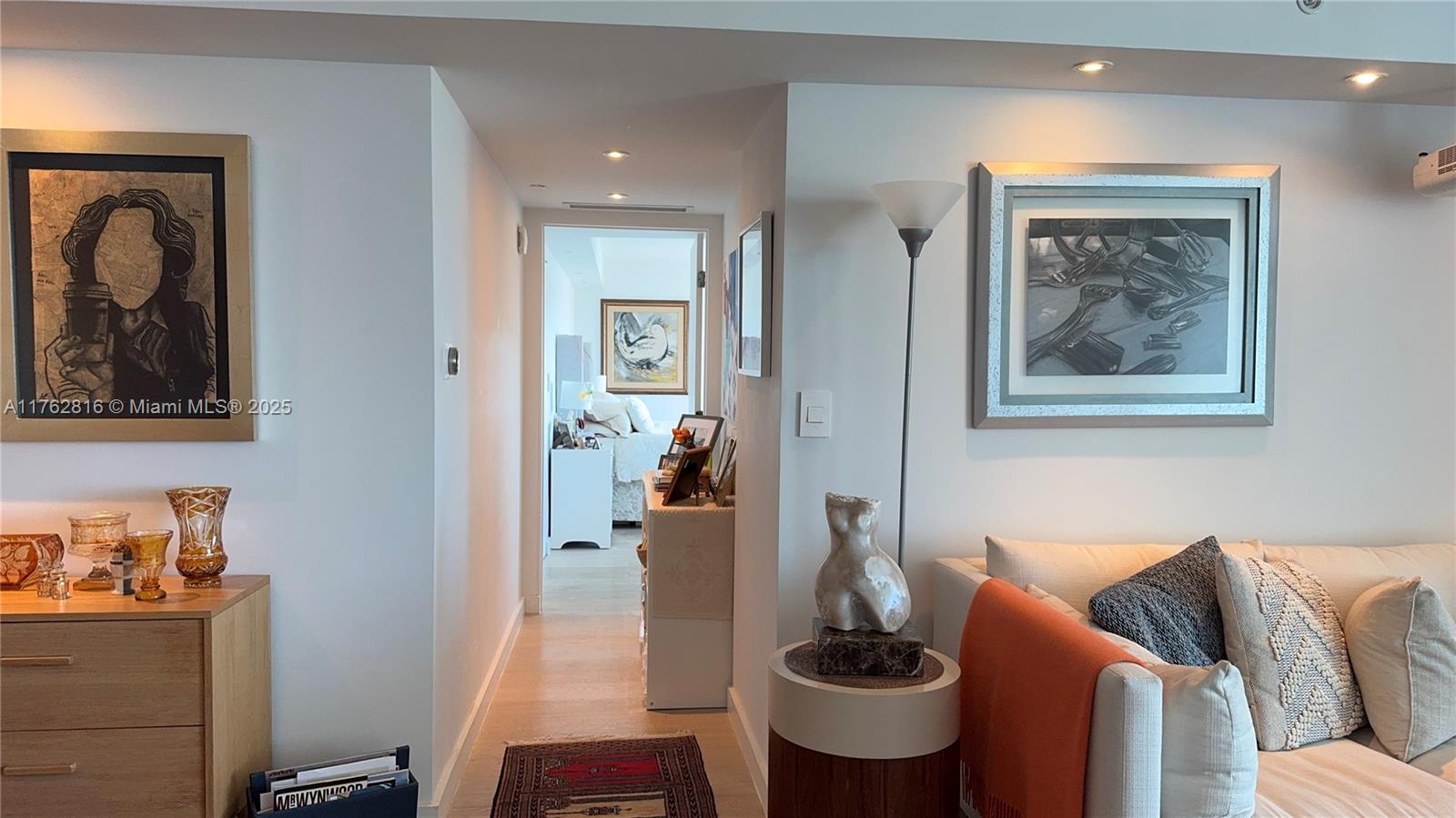 2101 Brickell Avenue, Unit 1012 Miami, FL 33129 - Photo 37 of 40 a living room with furniture and a painting