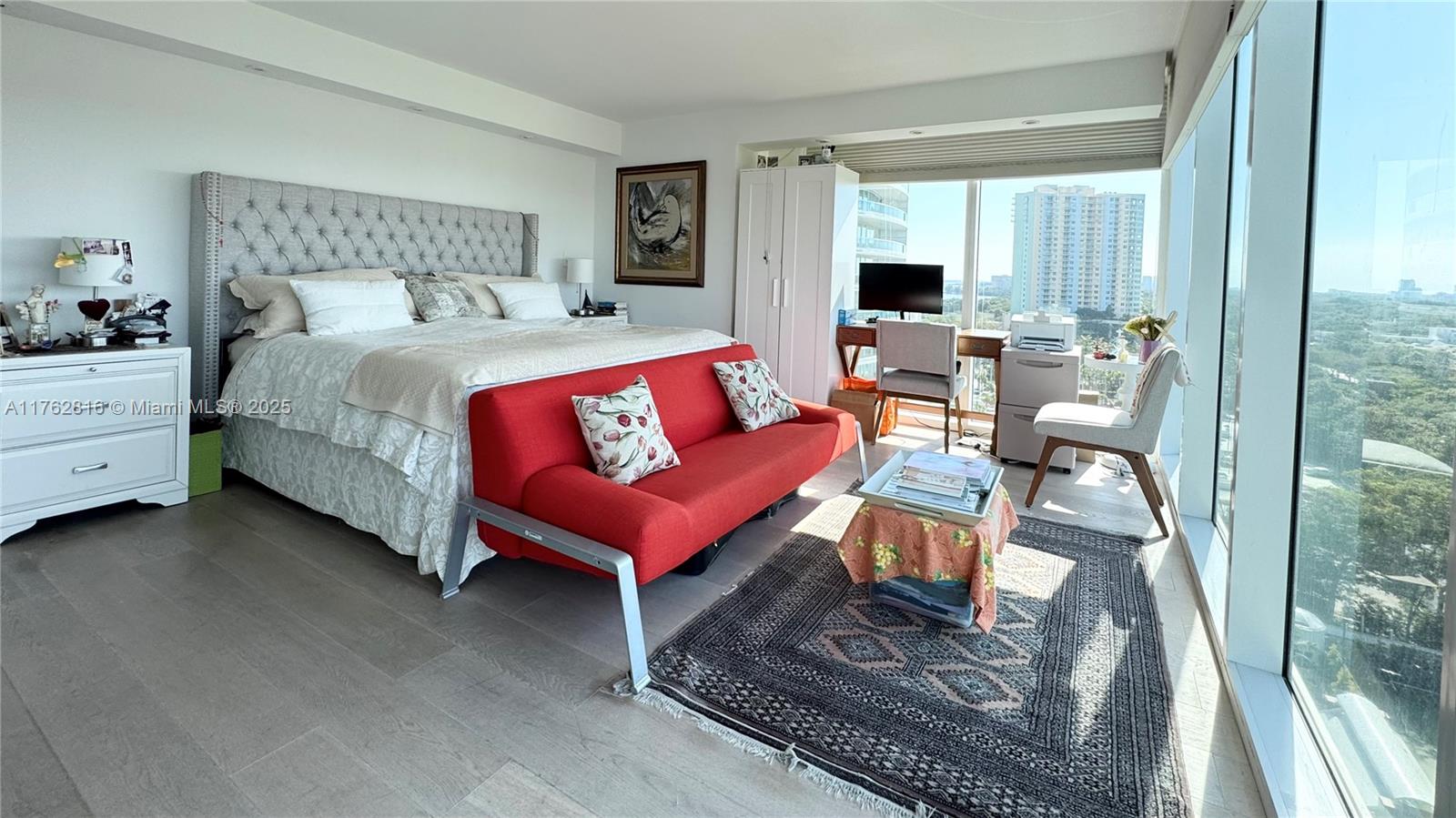 2101 Brickell Avenue, Unit 1012 Miami, FL 33129 - Photo 38 of 40 a living room with furniture a flat screen tv and a fireplace