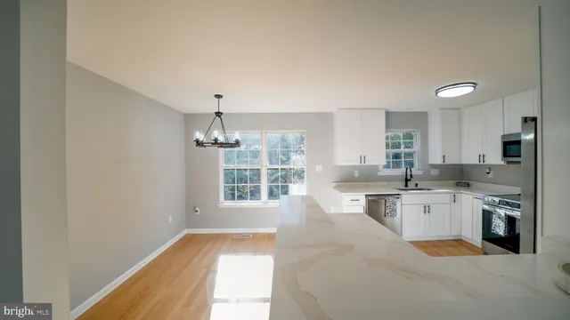 a kitchen with a stove and a refrigerator