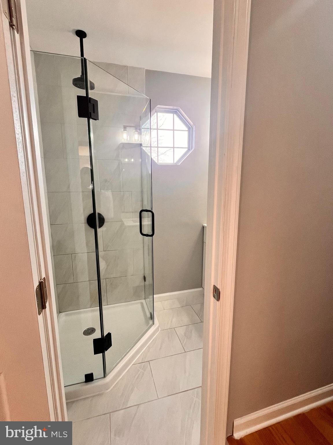 6934 Village Stream Place Gainesville, VA 20155 - Photo 21 of 31 a bathroom with a shower