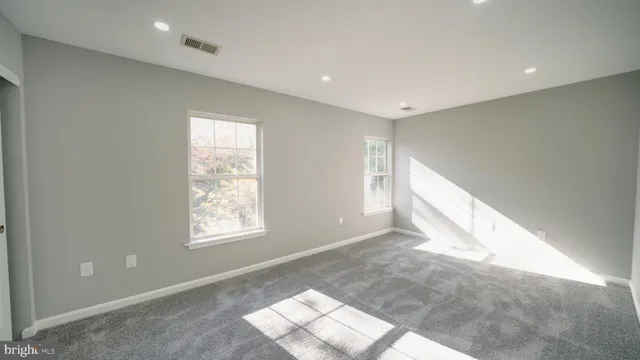 an empty room with windows