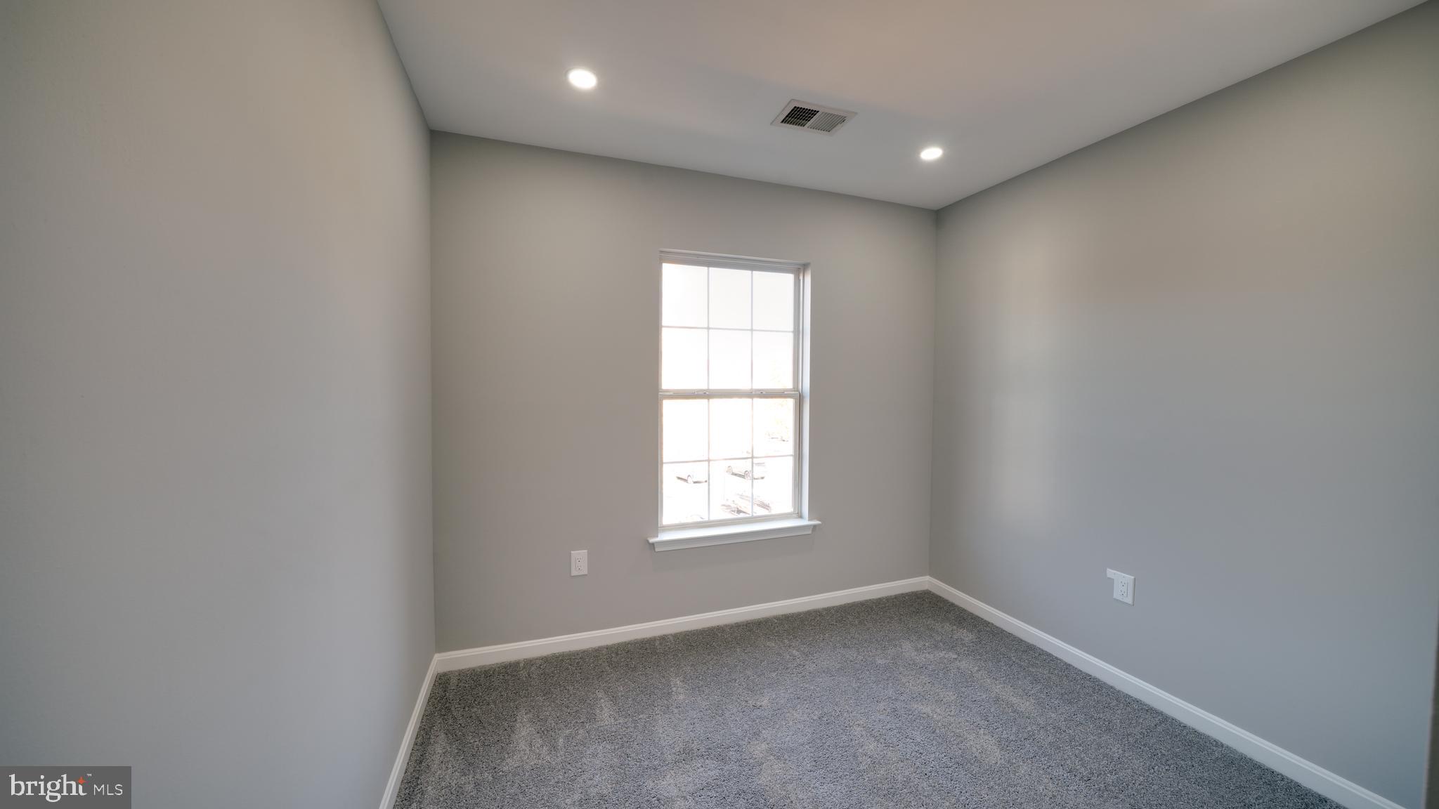 6934 Village Stream Place Gainesville, VA 20155 - Photo 27 of 31 an empty room with windows