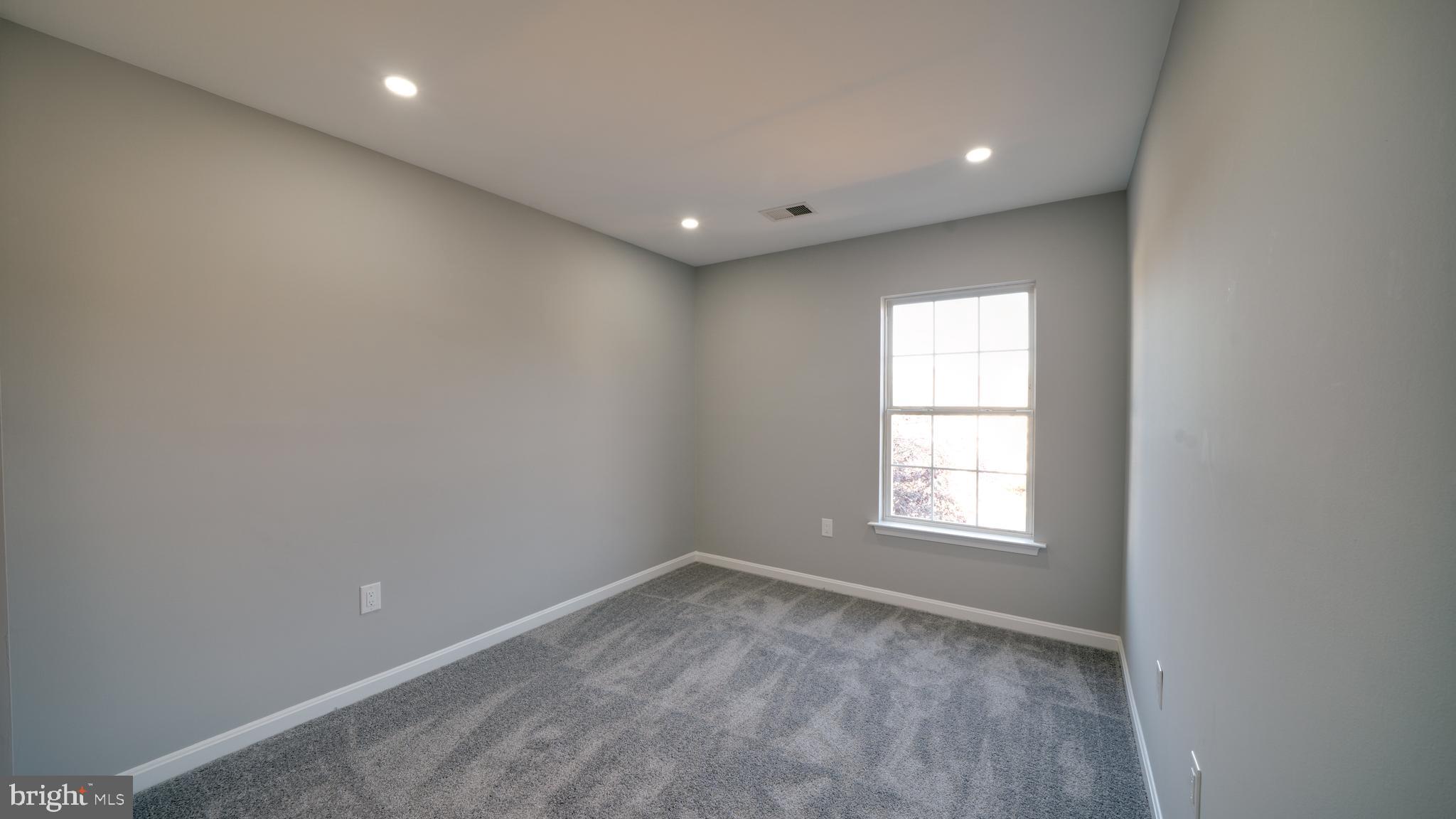 6934 Village Stream Place Gainesville, VA 20155 - Photo 28 of 31 an empty room with a window