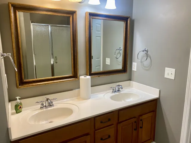 a bathroom with a bathtub and a window