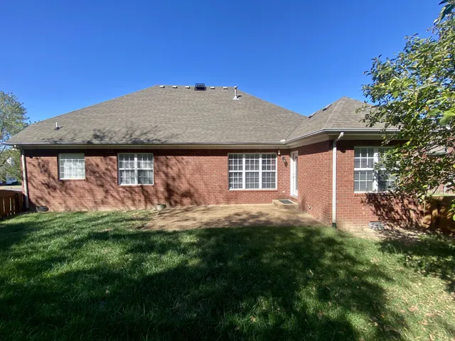 a view of backyard with outdoor space