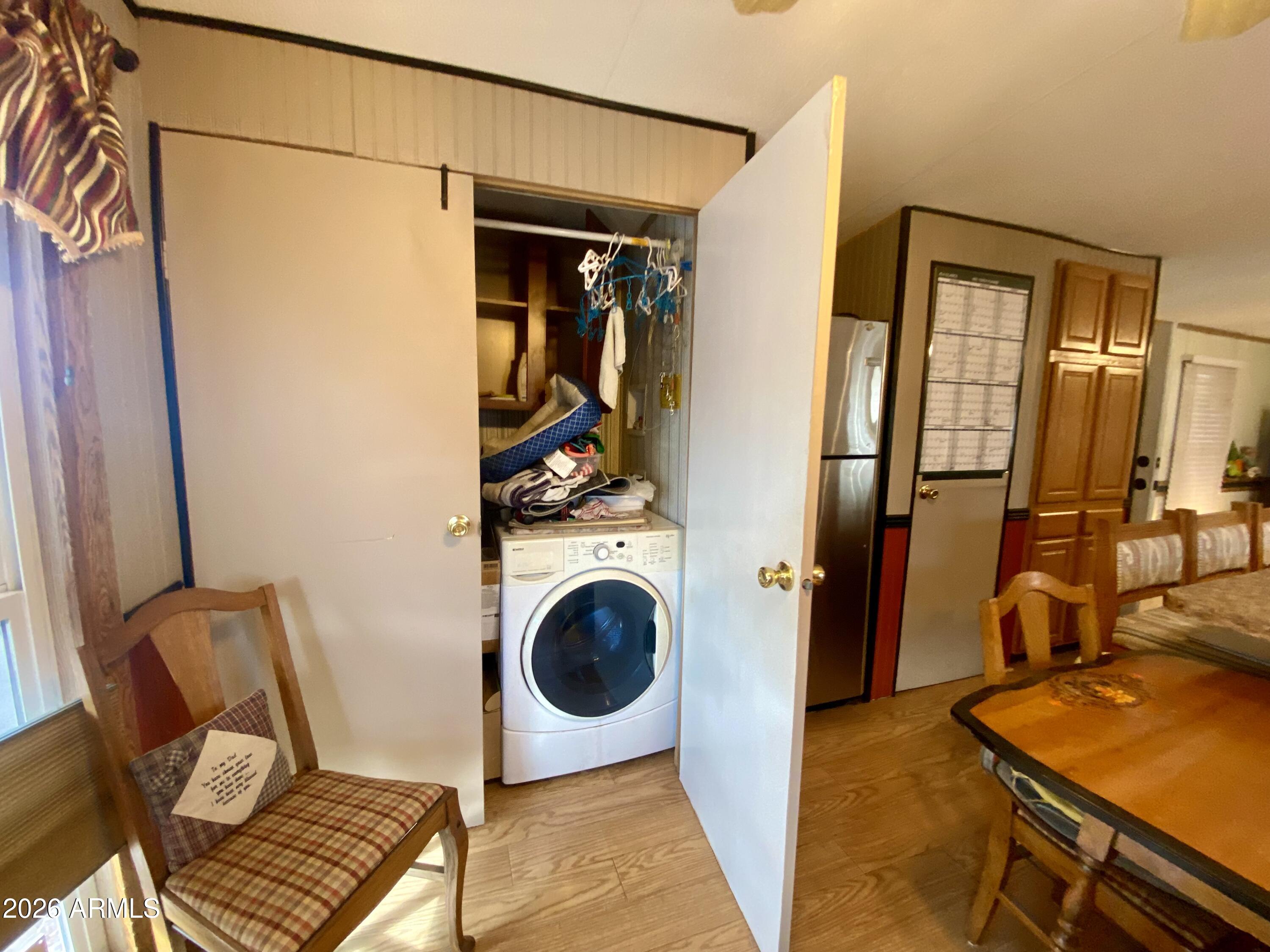 723 Finnie Flat Road, Unit 103 Camp Verde, AZ 86322 - Photo 12 of 41 a view of a hallway with washer and dryer