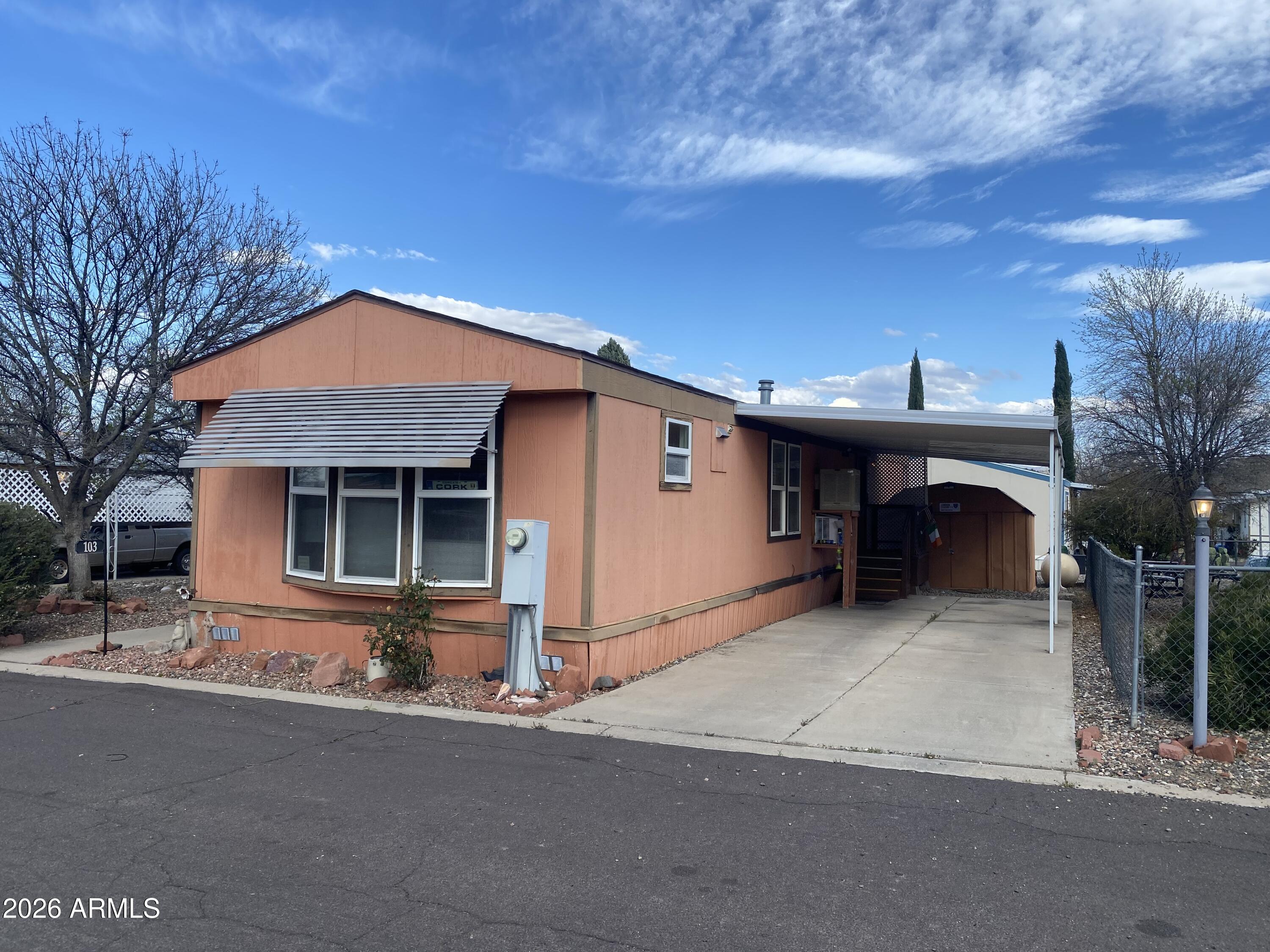 723 Finnie Flat Road, Unit 103 Camp Verde, AZ 86322 - Photo 2 of 41 front view of a house with a garage