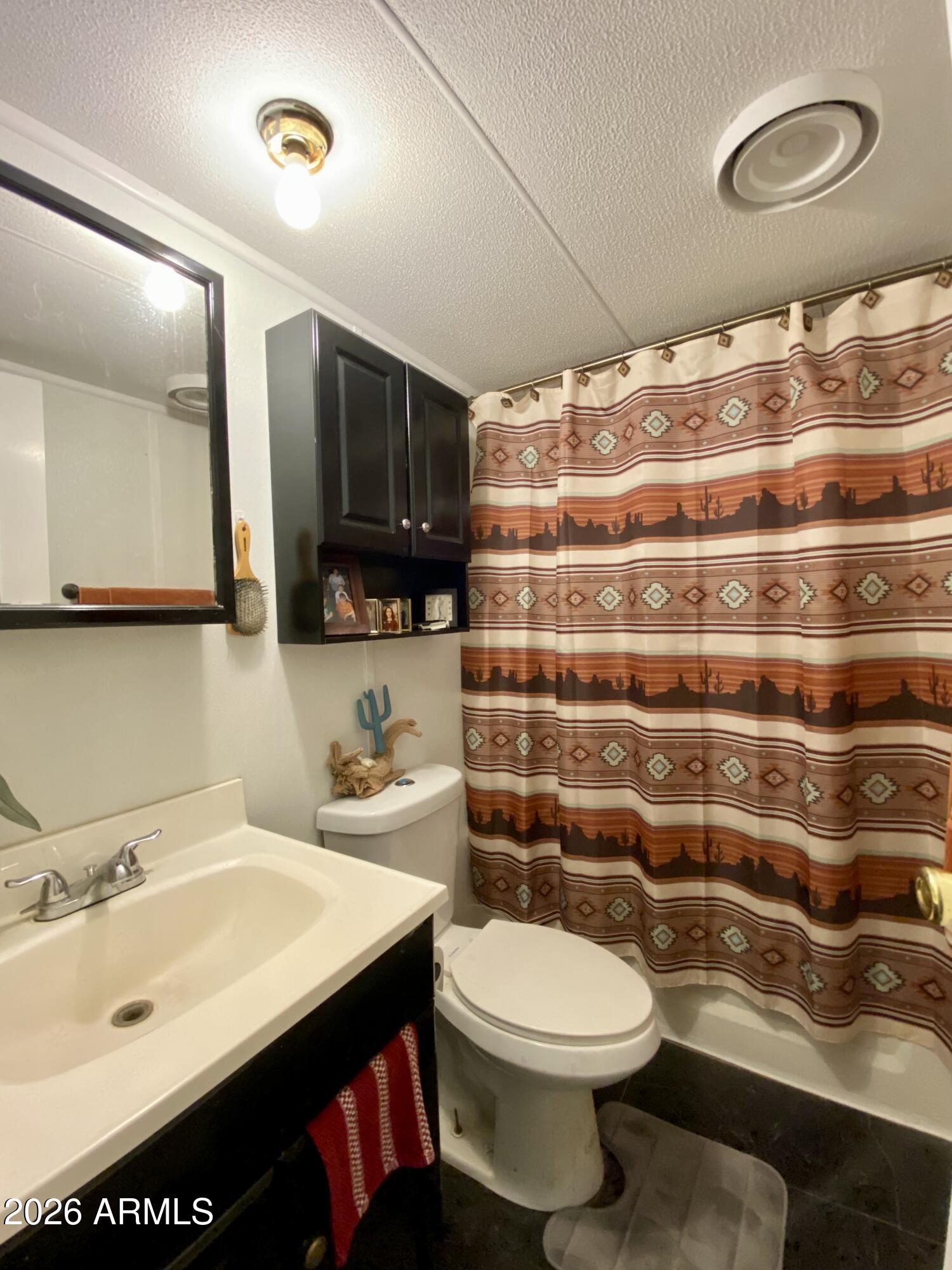 723 Finnie Flat Road, Unit 103 Camp Verde, AZ 86322 - Photo 21 of 41 a bathroom with a sink and a mirror